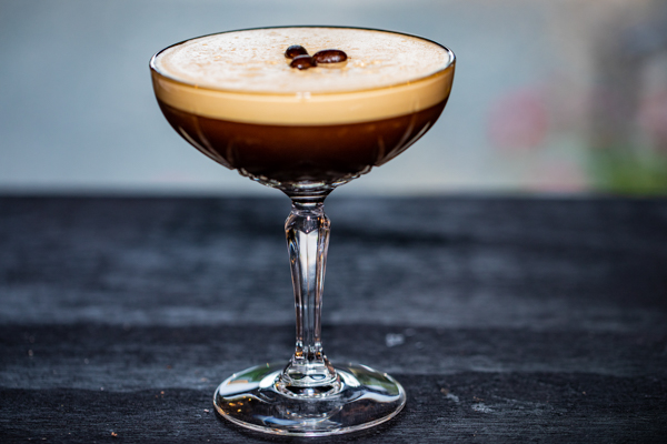 An elegant "Espresso Martini" at Incanto, featuring Reyka Vodka, espresso liqueur, turbinado sugar, and a double espresso shot, garnished with coffee beans