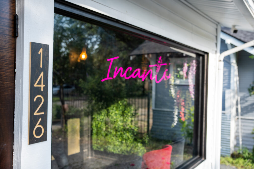 After-work bars in The Heights Houston – Incanto exterior window and neon sign