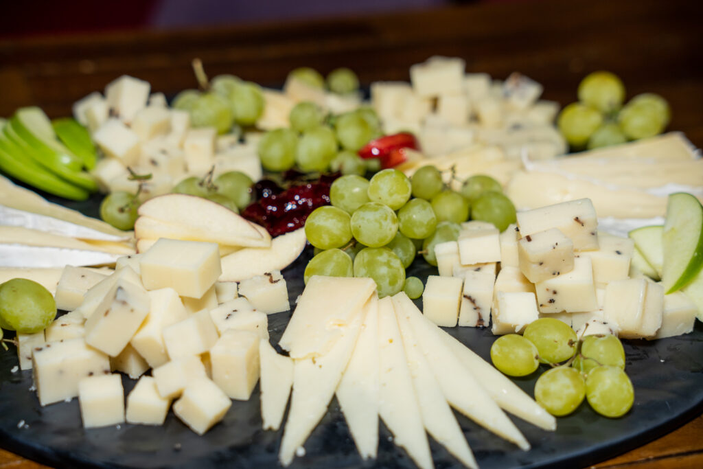Cheese board from the Incanto menu with grapes, nuts, and crostini