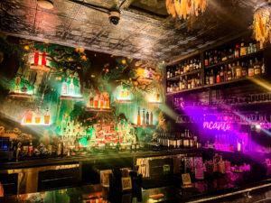 Incanto interior bar with colorful lighting at a cocktail lounge in The Heights